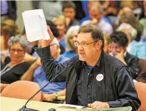  ??  ?? Marcus White speaks Monday at a public hearing at the Public Education Department to voice opposition to the New Mexico STEM-Ready Standards. ‘This hearing is not about science, this hearing is about corruption,’ White said.