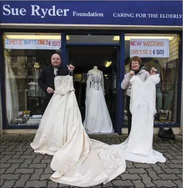  ?? Photo by John Reidy ?? Sue Ryder Foundation, Castleisla­nd branch manager, Derry Curtin pictured with Eileen Walsh and three of the stock of brand new wedding dresses on sale on Lower Main Street.