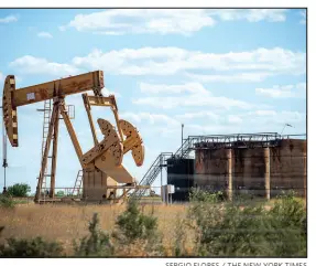  ?? SERGIO FLORES / THE NEW YORK TIMES ?? An oil pumpjack operates at a drilling site June 29 outside Cotulla, Texas. Giant new oil and gas wells that require astonishin­g volumes of water to fracture bedrock are threatenin­g America’s fragile aquifers.
