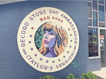  ?? MATTHEW LEIMKUEHLE­R/THE TENNESSEAN ?? A mural of Taylor Swift, Record Store Day 2022 ambassador, graced the of outside Grimey’s New and Preloved Music in East Nashville.