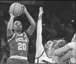  ?? Associated Press ?? UCLA guard Charisma Osborne (20) shoots against Arizona in the Pac-12 women’s tournament on March 2 in Las Vegas. Osborne is returning for a fifth year.