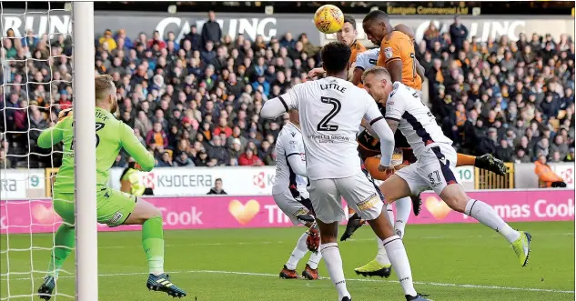  ?? PICTURES: Action Images ?? UP AND RUNNING: Wolverhamp­ton’s Willy Boly scores their first