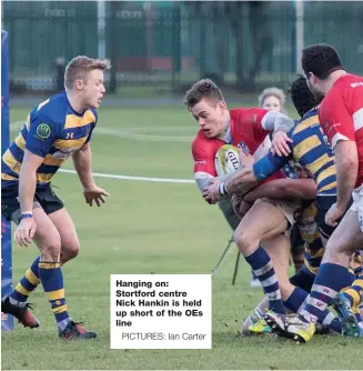  ?? PICTURES: Ian Carter ?? Hanging on: Stortford centre Nick Hankin is held up short of the OEs line