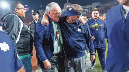 ?? MICHAEL CATERINA/BEND TRIBUNE ?? Will a new College Football Playoff format mean happier days ahead for Notre Dame athletic director Jack Swarbrick and coach Brian Kelly?