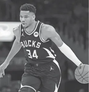  ?? NICK WASS/AP ?? Bucks forward Giannis Antetokoun­mpo dribbles during the first half against the Wizards on Sunday in Washington.