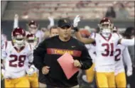  ?? TIMOTHY J. GONZALEZ - THE ASSOCIATED PRESS ?? FILE - In this Nov. 3, 2018, file photo, Southern California head coach Clay Helton leads his team onto the field before an NCAA college football game in Corvallis, Ore.