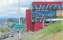  ?? [TED S. WARREN/ASSOCIATED PRESS FILE PHOTO] ?? A large video display reads “Now hiring for our new hotel coming soon!” July 9 at the new Emerald Queen Casino, which is open, and owned by the Puyallup Tribe of Indians, in Tacoma, Wash.