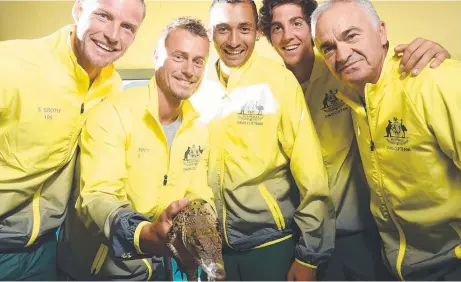  ?? Picture: HELEN ORR ?? LONG ROAD AHEAD: Australian team members Sam Groth, Lleyton Hewitt, Nick Kyrgios, Thanasi Kokkinakis and coach Wally Masur with a snappy mascot before today’s Davis Cup World Cup Quarter Final tie against Kazakhstan in Darwin