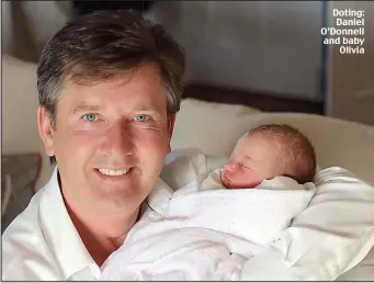  ??  ?? Doting: Daniel O’Donnell and baby
Olivia