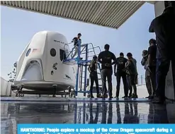  ??  ?? HAWTHORNE: People explore a mockup of the Crew Dragon spacecraft during a media tour of SpaceX headquarte­rs and rocket factory.