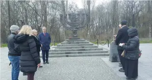  ?? (Ilanit Chernick) ?? VISITORS, including World ORT leaders, mark Holocaust Remembranc­e Day at the Babi Yar memorial in Kiev.