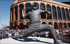  ?? John Minchillo / Associated Press ?? A statue of the late Mets pitcher Tom Seaver is revealed outside Citi Field before a baseball game against the Diamondbac­ks on April 15 in New York.