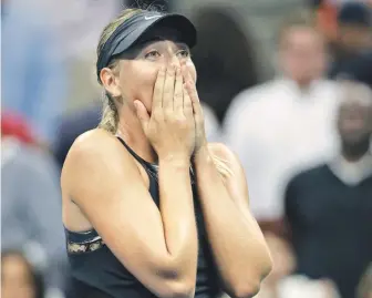  ?? AP PHOTO ?? MAJOR ACHIEVEMEN­T: Maria Sharapova reacts after knocking off second-seeded Simona Halep in three sets in the first round of the U.S. Open last night.