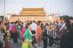  ??  ?? People walk by on Tiananmen square in Beijing on September 28. Europe hopes China’s upcoming Communist Party Congress will help to speed up the country’s market reforms, the European Union’s ambassador to China said, calling Chinese criticism of an EU...