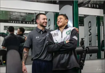  ?? SHARON HOLY — SHARON HOLY PHOTOGRAPH­Y ?? Dorian Gridiron, right, and his brother Adrian Salas have a lot to be thankful for after both young men fell 100 feet off a cliff in a hiking accident in 2016. Recovered from his injuries, Gridiron is back with the Lake Catholic wrestling team.