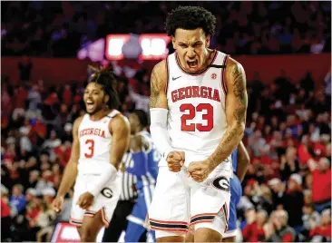  ?? ALEX SLITZ/ASSOCIATED PRESS ?? Georgia’s Braelen Bridges (right) and Kario Oquendo react to a clutch play in the first half Saturday against Kentucky in Athens. Bridges was key in the waning moments of the impressive win over the Wildcats.