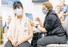  ?? POSTMEDIA NEWS ?? As the COVID-19 vaccine continues to be administer­ed across the country, the number of Canadians now eager and willing to be vaccinated has surged in a few short weeks.