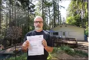  ?? PHOTO BY JIM GENSHEIMER ?? Don Baker shows a nonrenewal insurance notice from State Farm at his home in Boulder Creek on June 3. Baker is one of countless California­ns who are suddenly finding it harder to insure their homes because of recent disasters.