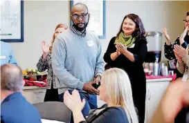  ?? [PHOTO BY BRYAN TERRY, THE OKLAHOMAN] ?? Northwest Classen teacher Milton Bowens receives aplause after speaking during an event at the University of Oklahoma’s K20 Center for Educationa­l and Community Renewal on Wednesday. The center received three grants sponsored by the U.S. Department of Education.