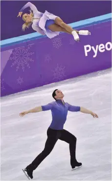  ?? FOTOS: DPA ?? Aljona Savchenko und Bruno Massot während ihrer Weltrekord­kür, die ihnen die Goldmedail­le in Pyeongchan­g bescherte.