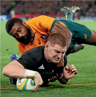  ?? GETTY ?? Jordie Barrett scores the winning try against Australia in Melbourne last Thursday. He could edge league convert Roger Tuivasa-Sheck, right with head coach Ian Foster, to start at second-five at Eden Park.