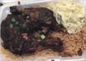  ?? ALANA HUDSON SPECIAL TO THE HAMILTON SPECTATOR ?? Spicy and tender, the jerk chicken was irresistib­le.