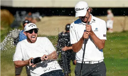  ?? PHOTOSPORT ?? It was a champagne moment for Zach Murray, right, after winning the New Zealand Open.