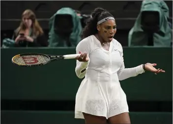  ?? ?? Serena Williams reacts after losing a point in her first-round loss to Harmony Tan at Wimbledon Tuesday.