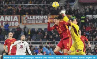  ?? ?? ROME: Roma’s Serbian goalkeeper #99 Mile Svilar makes a save in front of teammate Roma’s English defender #06 Chris Smalling during the Italian Serie A football match between AS Roma and Torino. — AFP