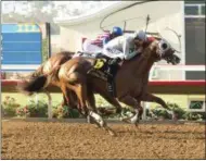  ?? BENOIT — THE ASSOCIATED PRESS ?? In a photo provided by Benoit Photo, California Chrome and jockey Victor Espinoza, foreground, hold off a persistent Dortmund, with Gary Stevens, to win the Grade II, $200,000 San Diego Handicap horse race Saturday, July 23, 2016, at the Del Mar...