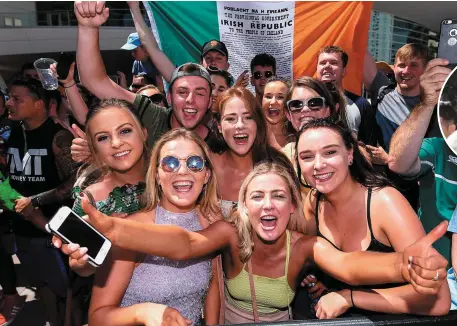  ??  ?? Supporters of Conor McGregor (inset) gather in Toshiba Plaza in Las Vegas ahead of the fight on Saturday. Photo: Sportsfile