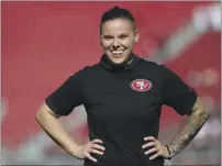  ?? JOSIE LEPE — THE ASSOCIATED PRESS, FILE ?? Katie Sowers watches warmups before a 2019 game between the 49ers and Cardinals in Santa Clara. Sowers served as an assistant coach for the 49ers for the last four seasons.