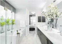  ??  ?? A sleek kitchen and luxurious ensuite are among the attractive features of the Reflection show suite at the new presentati­on centre at Westman Village.