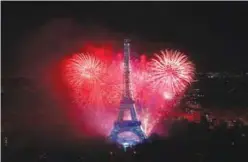  ??  ?? PARIS: Fireworks light the sky above the Eiffel Tower in the French capital Paris, as part of France’s annual Bastille Day celebratio­ns.—AFP