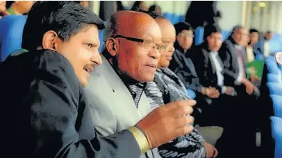  ?? Picture: GCIS ?? IN THE STANDS: Atul Gupta and Jacob Zuma at a T20 match between South Africa and India at Wanderers Stadium in 2012