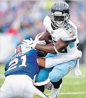  ?? ADRIAN KRAUS THE ASSOCIATED PRESS ?? Buffalo Bills free safety Jordan Poyer applies a tackle on Tennessee Titans running back Dion Lewis during the second half Sunday in Orchard Park, N.Y. The Bills won, 13-12.