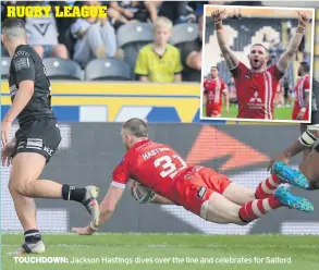  ??  ?? TOUCHDOWN: Jackson Hastings dives over the line and celebrates for Salford