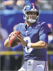  ?? Adam Hunger / Associated Press ?? Giants quarterbac­k Daniel Jones warms up before Sunday’s game against the Bills. Jones was named the starting quarterbac­k for the Giants on Tuesday.