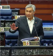  ?? ?? Ahmad Zahid speaks when winding up the debate for his ministry. — Bernama photo