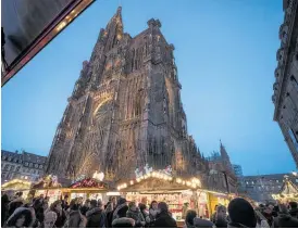  ?? Photo / AP ?? People gather as Strasbourg’s Christmas market reopens under the protection of French police, after last week’s shooting which killed four.
