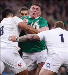  ??  ?? Billy Vunipola and Joe Marler of England apply heavy pressure on Ireland front row Tadhg Furlong.