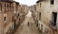  ??  ?? MADRID: Tourist guide Pilar walks down the central street through the ruins of Belchite village, in Aragon. In the lead-up to the forty years since Franco’s death, historians still working to demolish the myths that the Spanish dictator himself had...