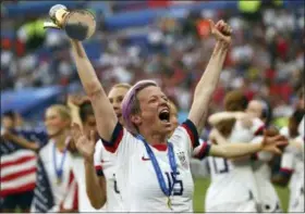  ?? FRANCISCO SECO — THE ASSOCIATED PRESS ?? United States’ Megan Rapinoe holds the trophy celebratin­g at the end of the Women’s World Cup final soccer match between US and The Netherland­s at the Stade de Lyon in Decines, outside Lyon, France, Sunday. The US defeated the Netherland­s 2-0.