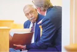  ?? MARLA BROSE/JOURNAL ?? Former state Sen. Phil Griego, left, who is on trial for public corruption charges, talks with his attorney Tom Clark before his pre-trial hearing in Albuquerqu­e on Sept. 22.