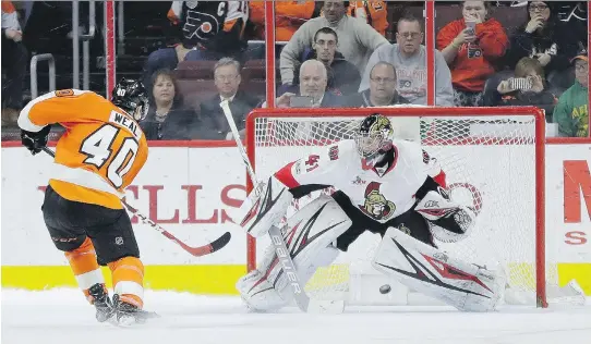  ?? MATT SLOCUM/THE ASSOCIATED PRESS ?? The Flyers’ Jordan Weal scores on Craig Anderson during the shootout Tuesday in Philadelph­ia. The Flyers won 3-2.