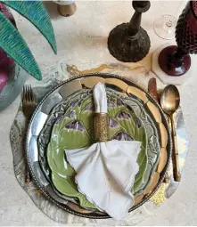  ?? ?? This page: A tablescape using Marga Nograles’s collection of dinnerware and cutlery curated over the years
Opposite page: The designer enjoys this space that marries art and craftsmans­hip