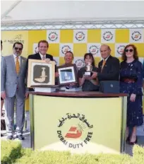  ??  ?? Colm Mcloughlin, Salah Tahlak and Sinead El Sibai pose with the winners during the presentati­on ceremony.