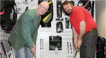  ??  ?? Peter Lowry and Niall Stafford trying out the putters.