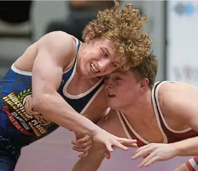  ?? Peter Diana/Post-Gazette ?? Wyatt Henson of Waynesburg defeated Caleb Rathjen of Ankeny, Iowa, to seal the win for the Pennsylvan­ia All-Stars. Both are headed to Iowa to wrestle for the Hawkeyes.