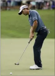  ?? CHRIS O’MEARA — THE ASSOCIATED PRESS ?? Kevin Kisner putts on the second hole during the third round of the PGA Championsh­ip golf tournament at the Quail Hollow Club Saturday in Charlotte, N.C.